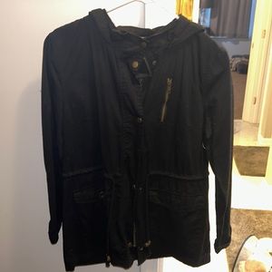 Black jacket with zipper and button closure